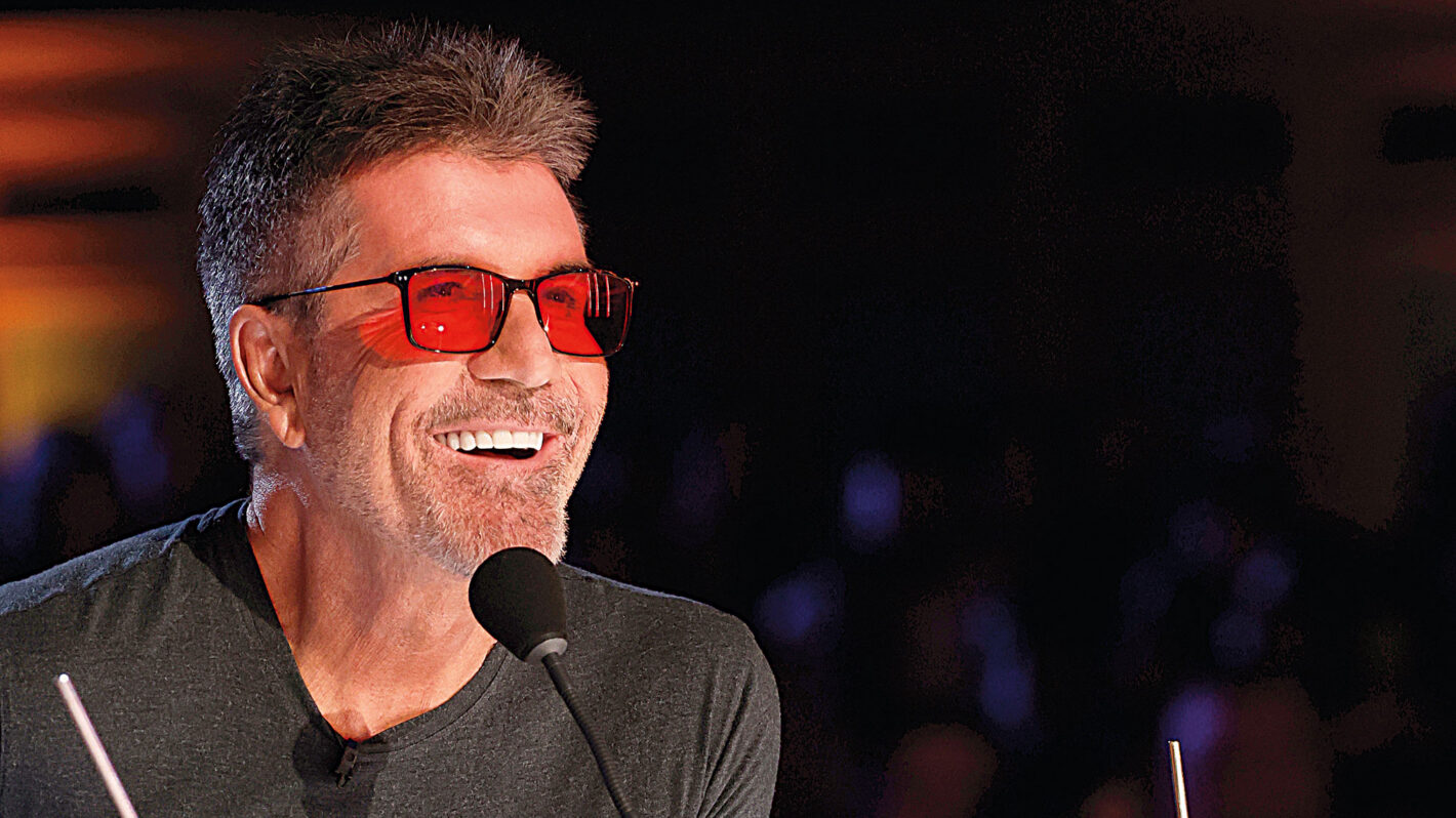 Simon Cowell smiling at the Britain’s Got Talent judges’ desk